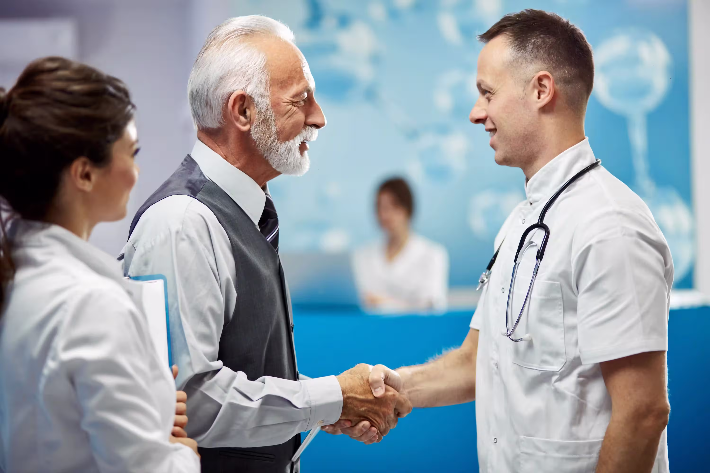 Doctor shaking hands with patient reflecting trust and healthcare billing clarity