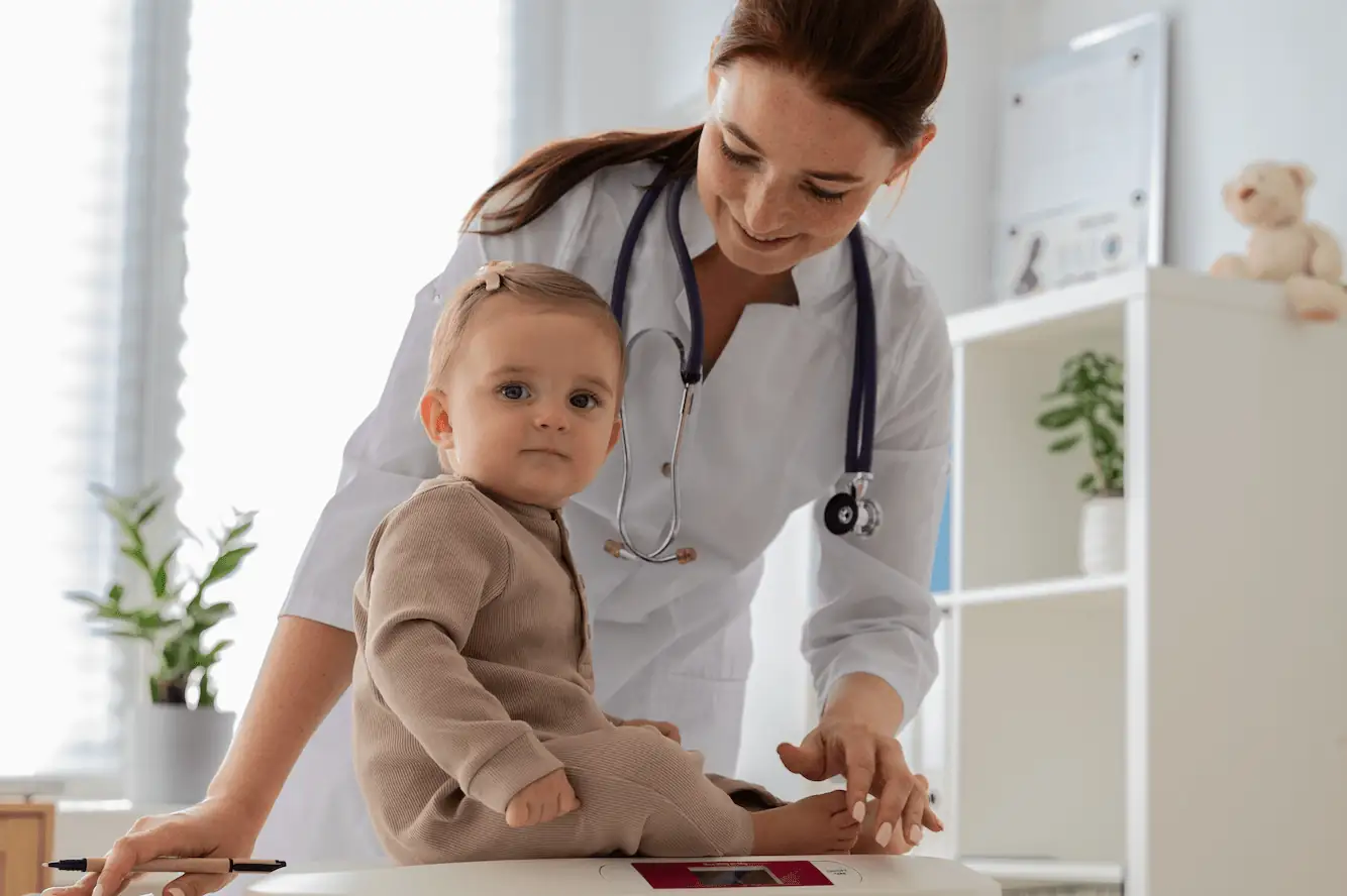 Doctor examining child during pediatric visit