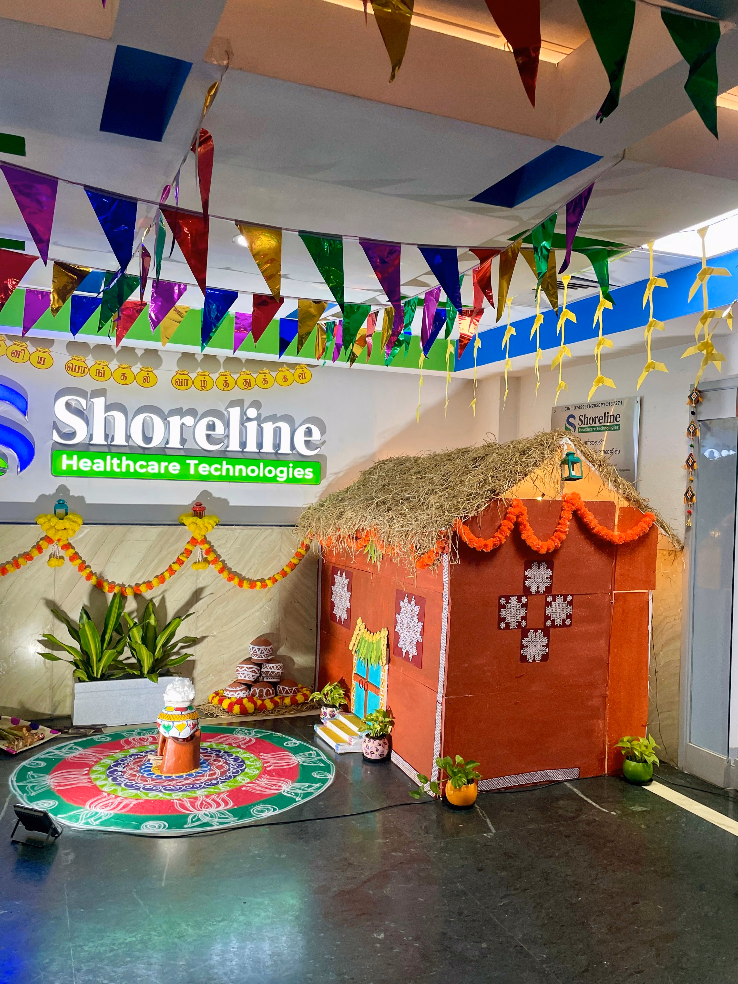 Traditional Village Thatched Hut and Festive Pongal Kolam Decoration